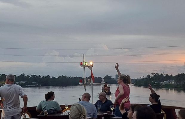 Admiring sunset at the Mekong Eyes Cruise